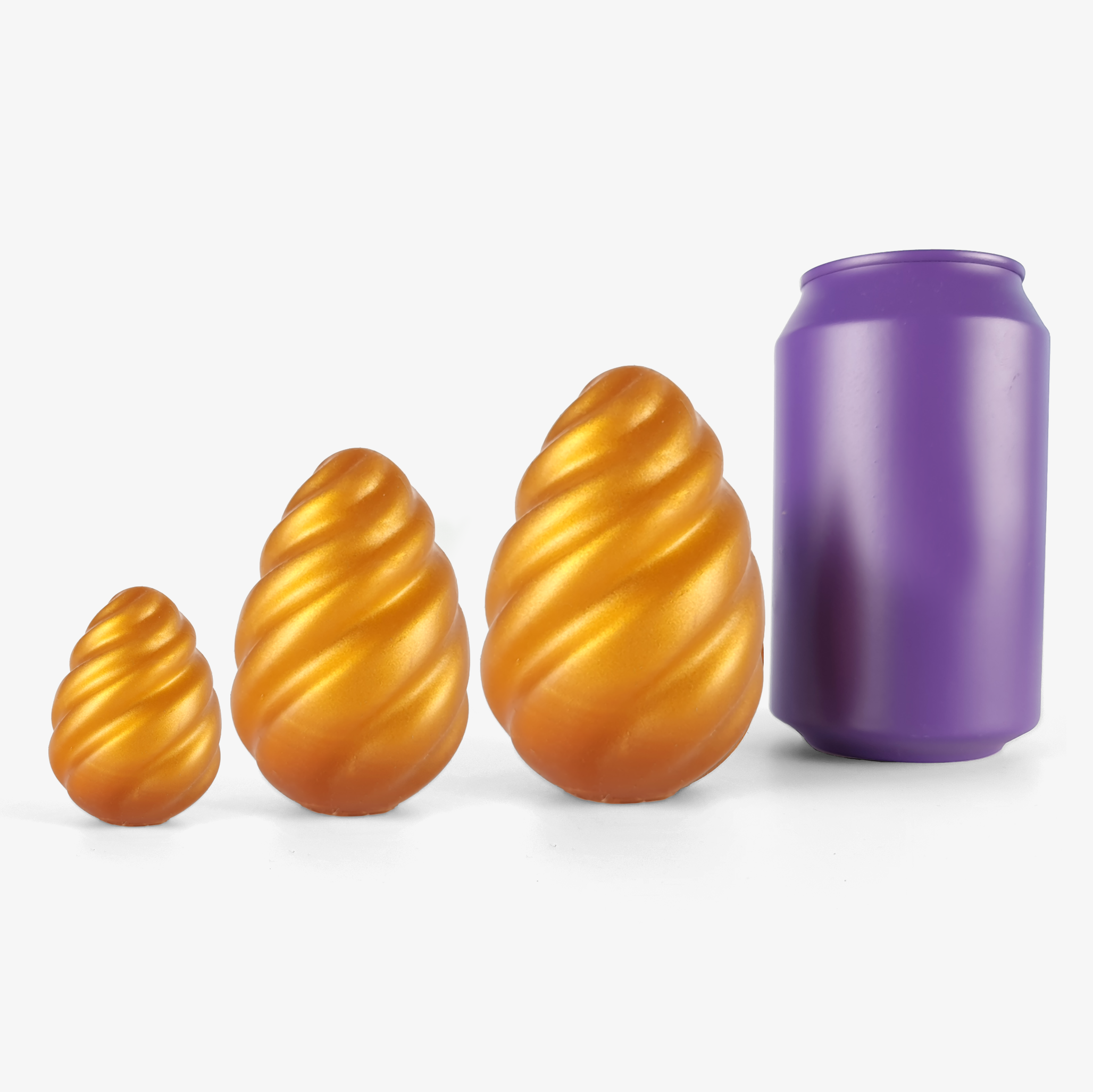 The swirling egg (set of 3) ben wa balls & egg size comparison next to 330ml can.