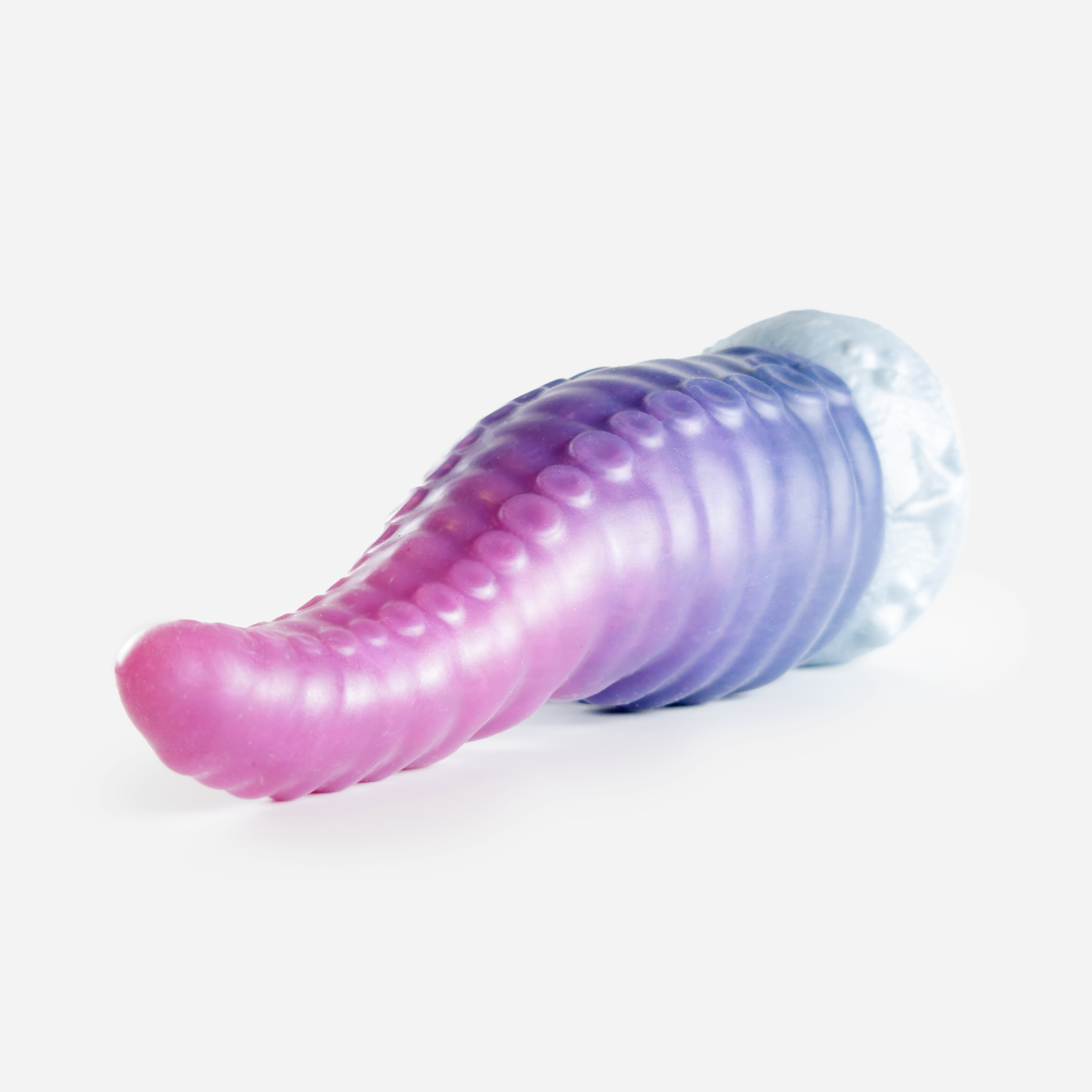 The tentacle dildo laying down.