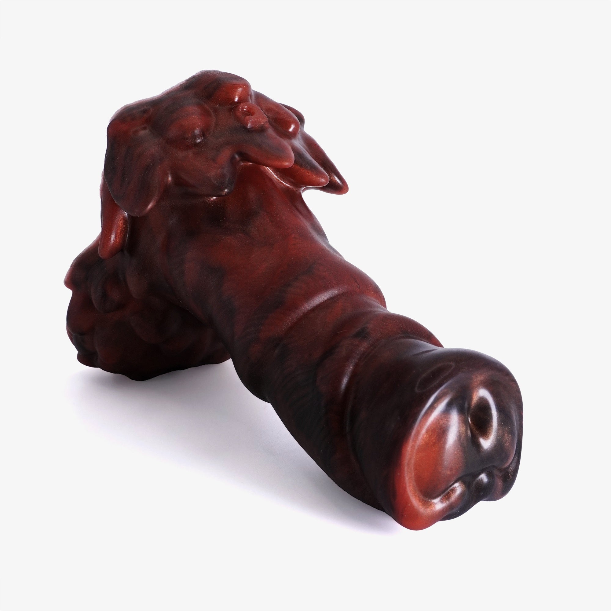 The owlbear dildo laying down.