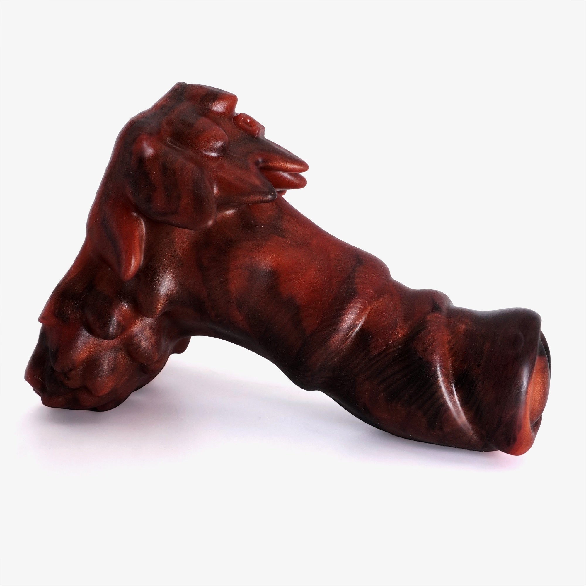 The owlbear dildo laying down side on.