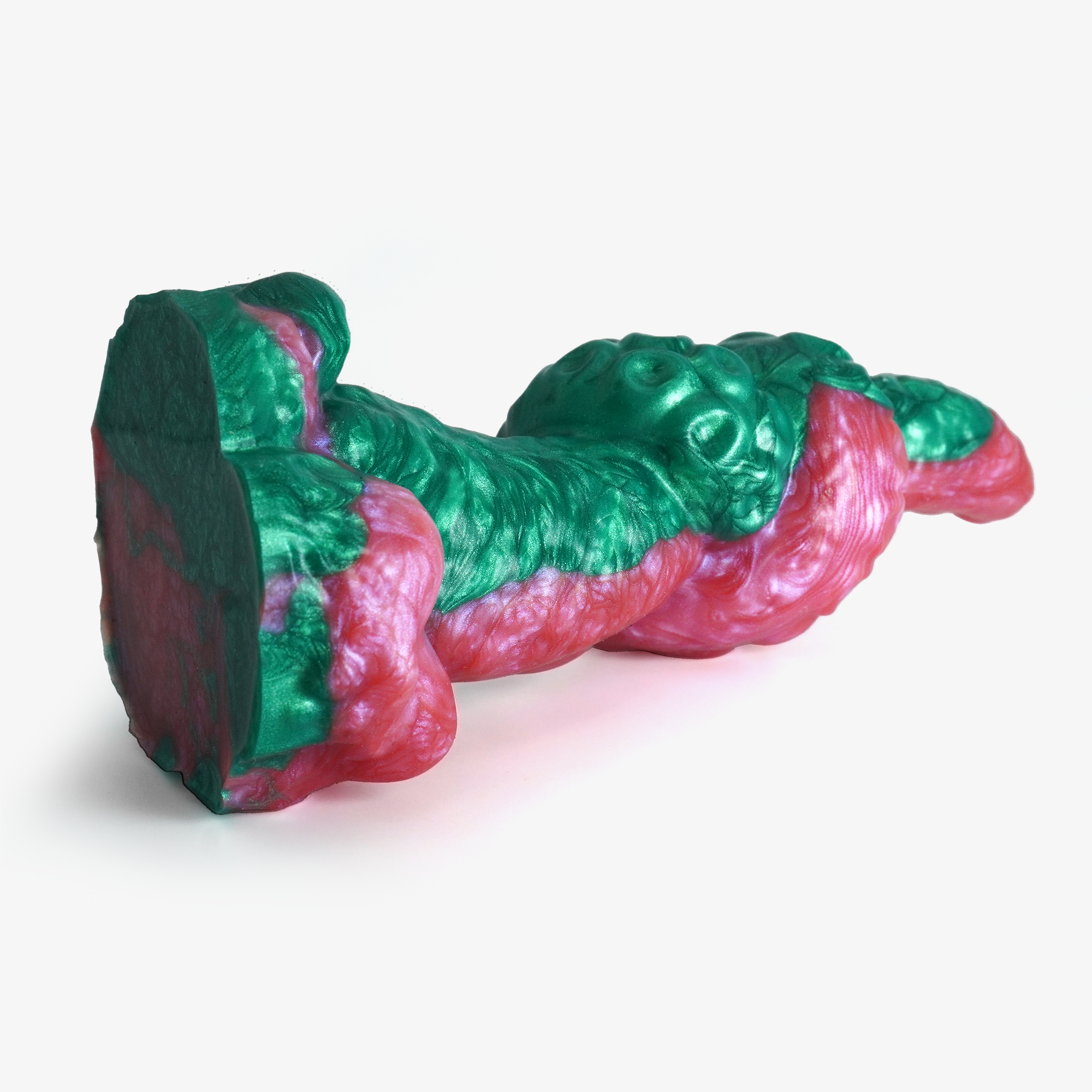 The tentacle: knot ii dildo laying down, showing base.