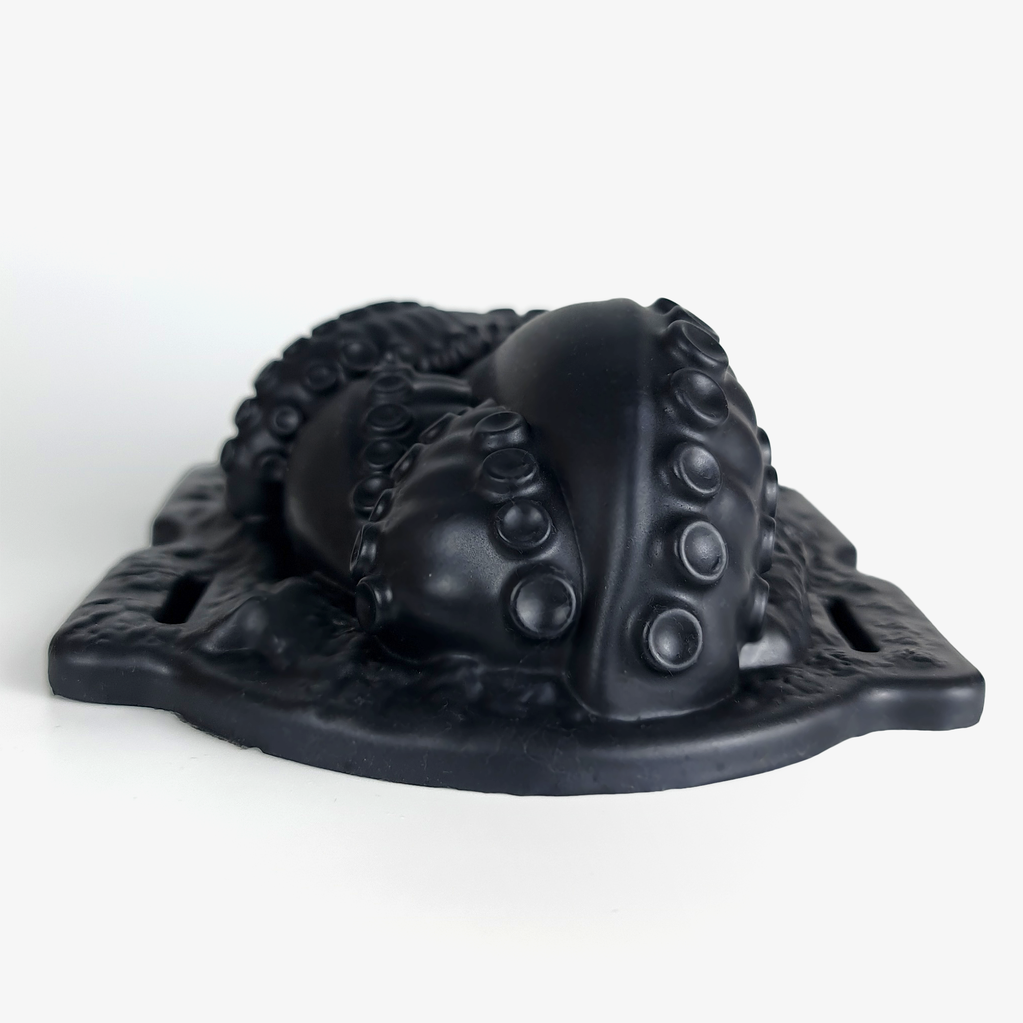 The tentacle grinder iii laying down front.